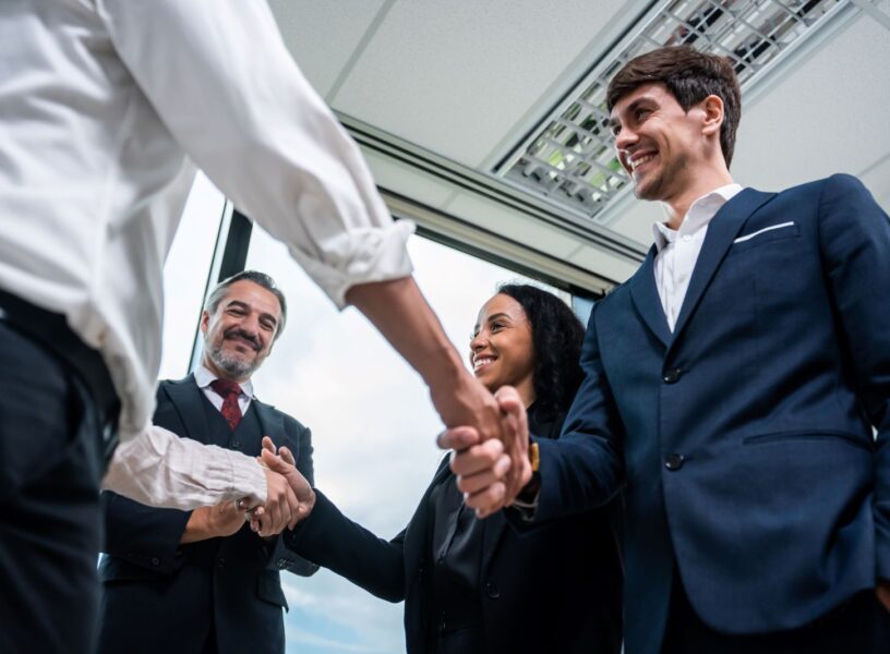 caucasian-businessman-making-a-handshake-together-2025-03-24-23-14-58-utc